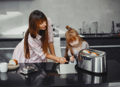 mother-with-daughter-kitchen-toaster